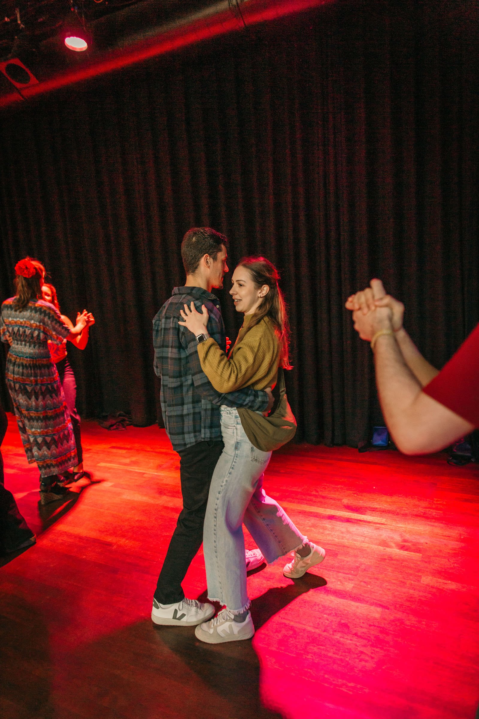 A couple dancing forró at a Baile da Dom party in Utrecht